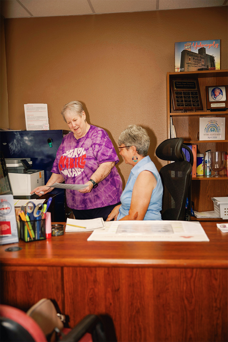 Joanne and Chris talking in the office